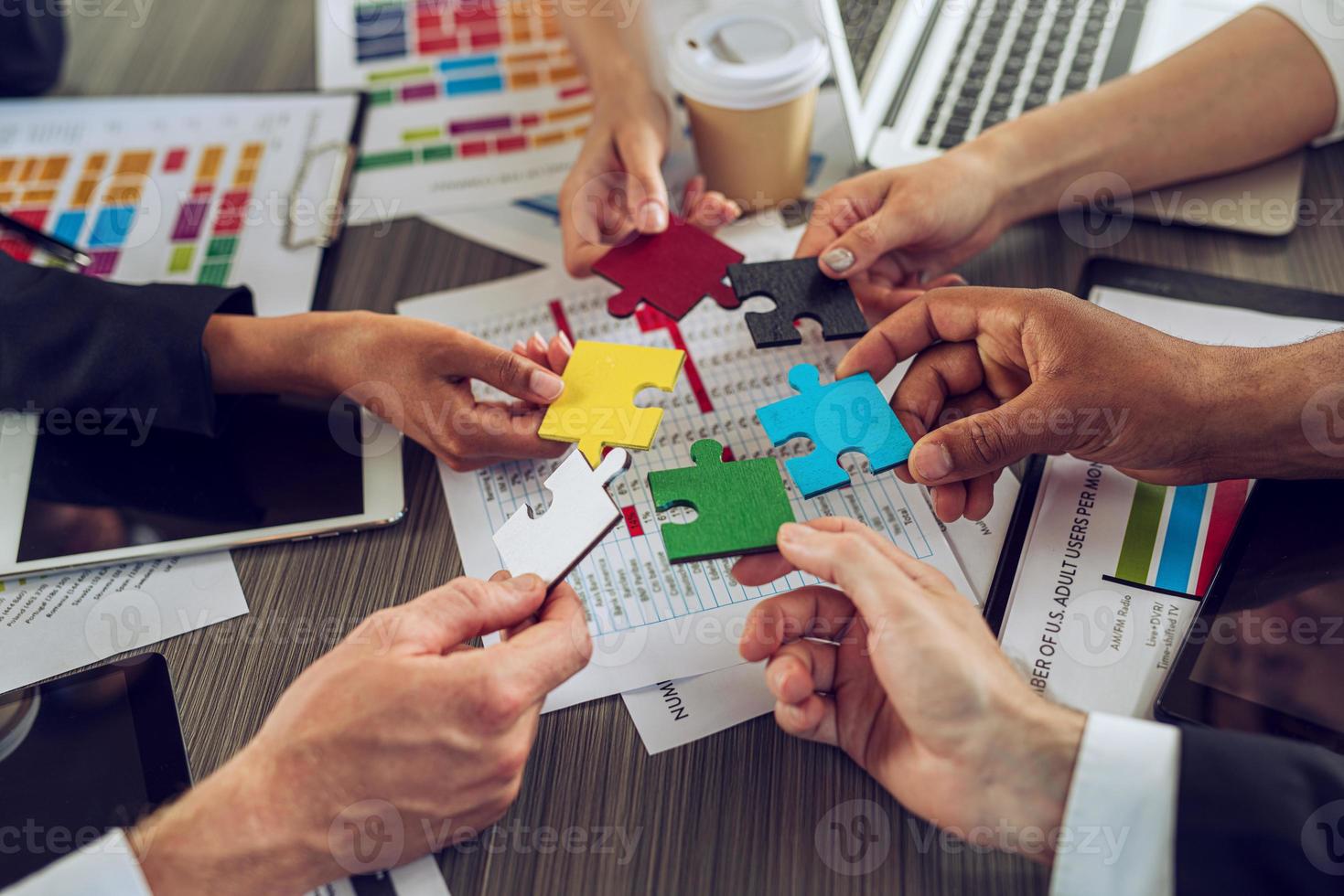 Teamwork of partners. Concept of integration and startup with puzzle pieces photo