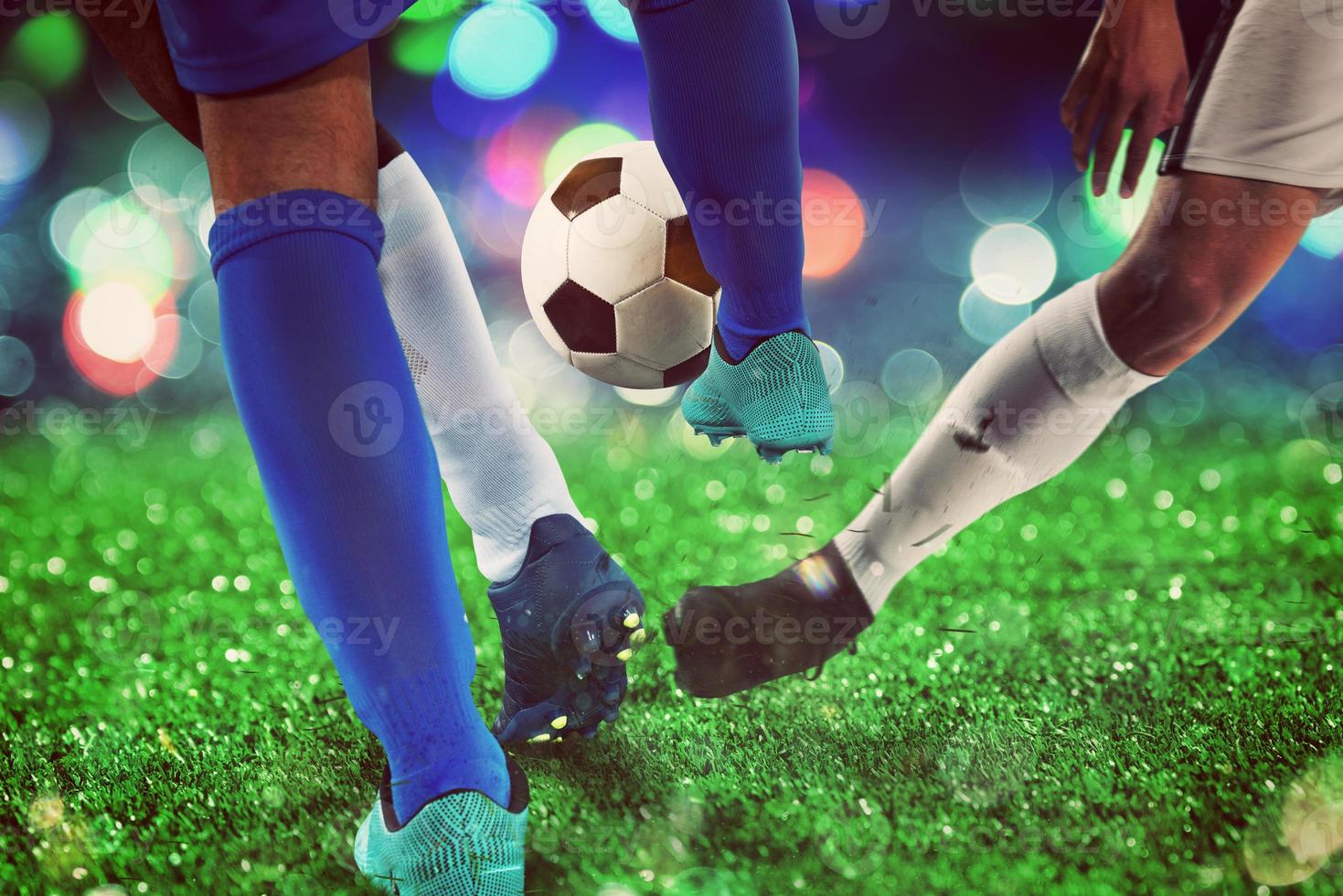 Football scene with competing soccer players at the stadium photo