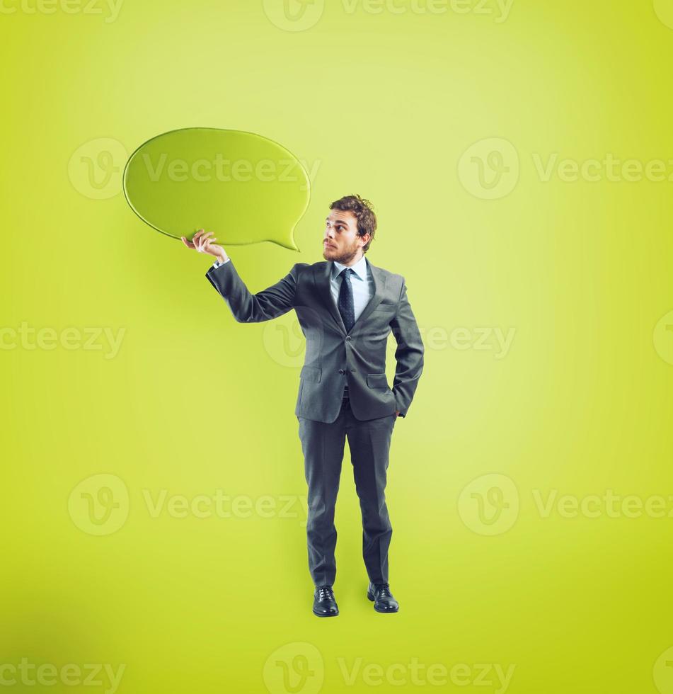 Businessman has something to say in a speech bubble photo