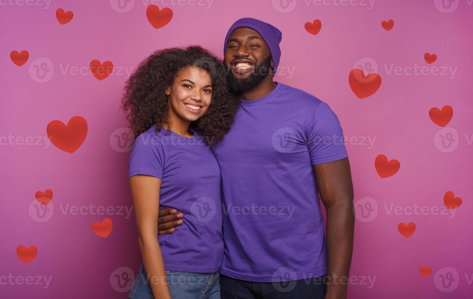 Happy couple are smiling. Concept of happiness. Purple background photo