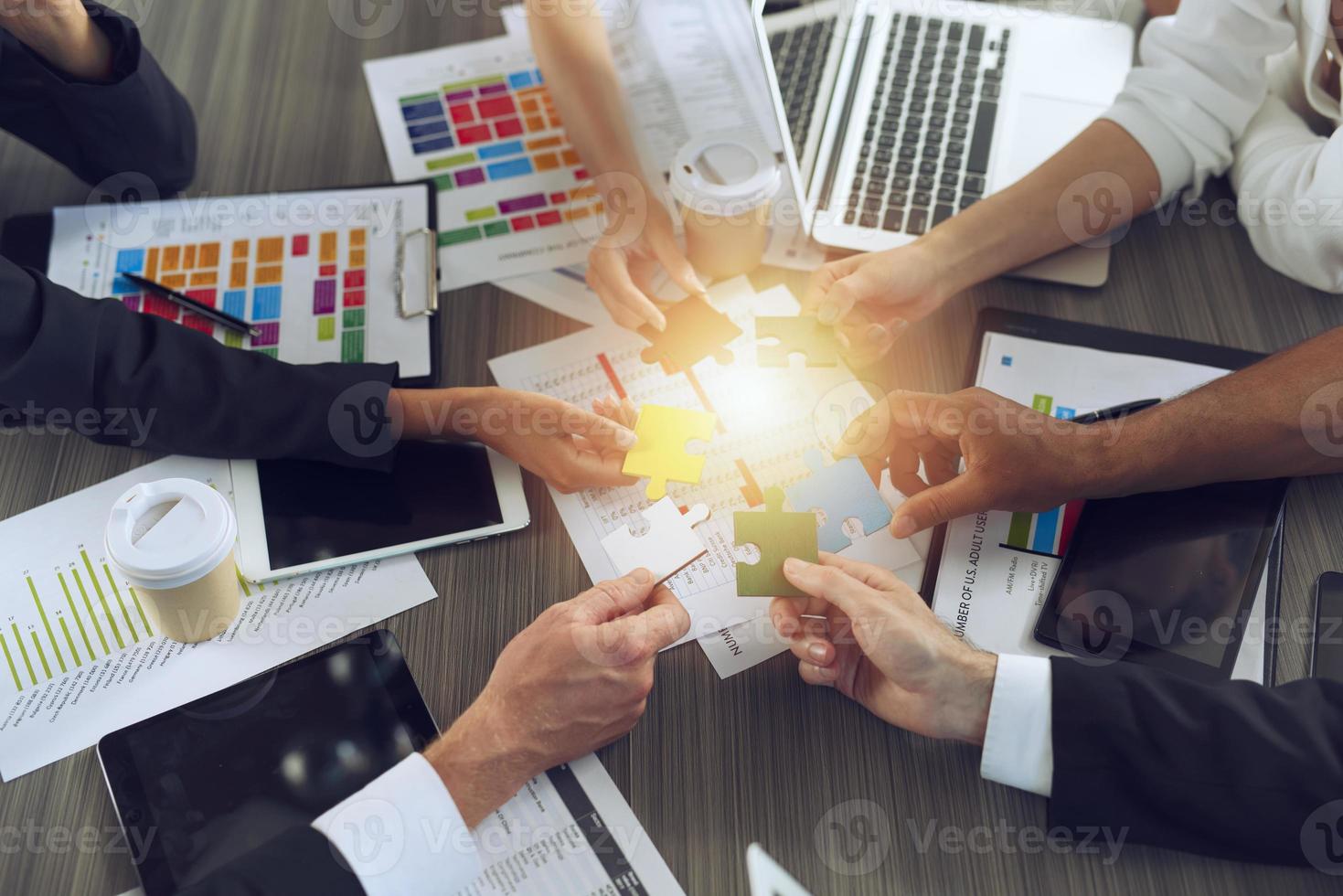 Teamwork of partners. Concept of integration and startup with puzzle pieces photo