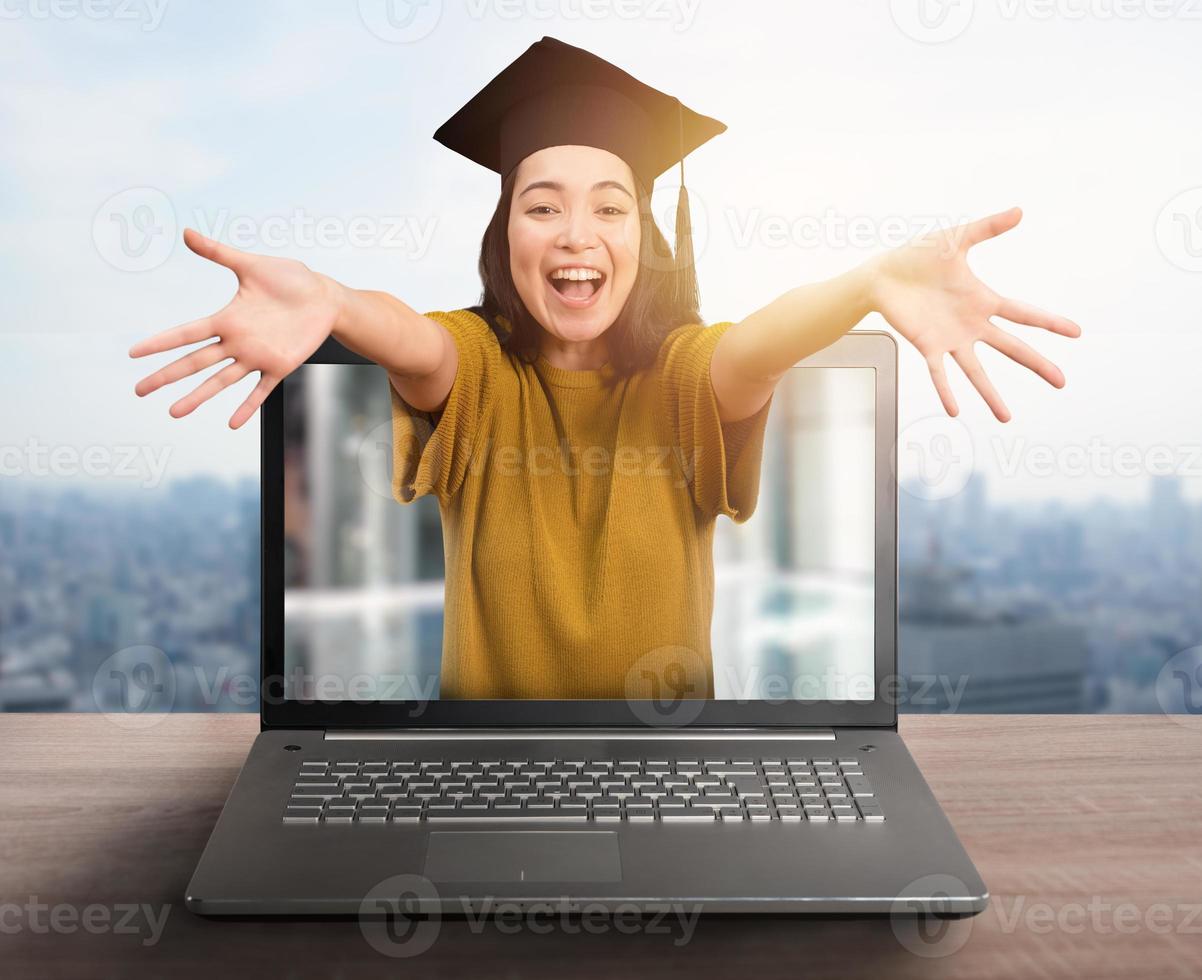 Woman is happy to achieved online graduation due to covid-19 virus problem photo