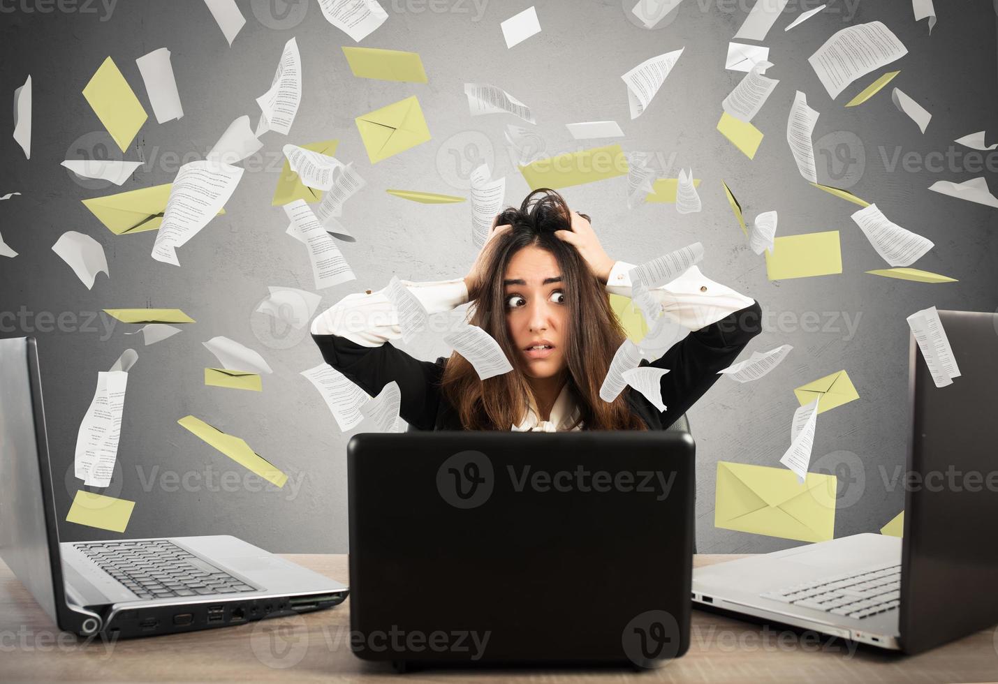Businesswoman stressed by spam photo