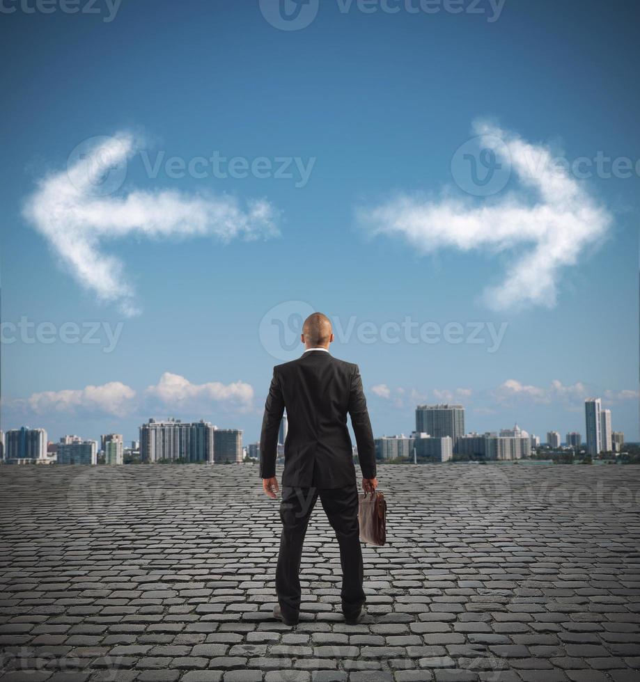 Confused businessman must choose the right way photo