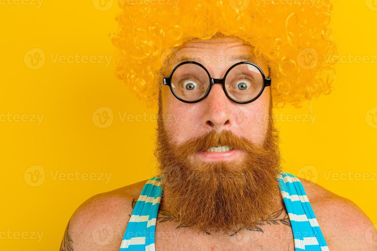 man with yellow beard,wig and glasses photo