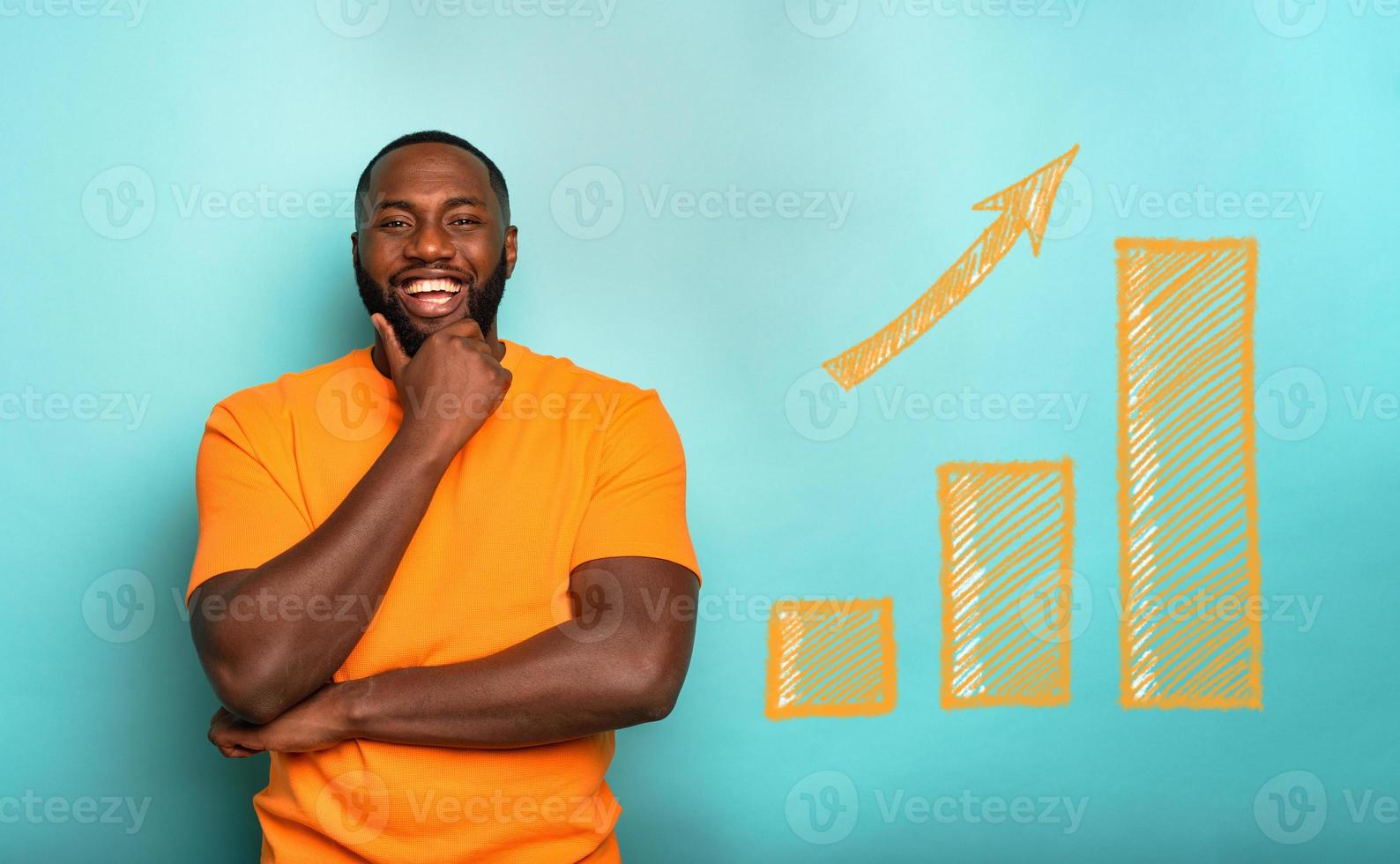 Joyful and happy man has success and increases the statistic photo