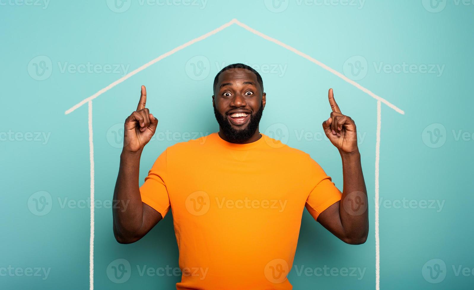 Concept of stay at home message with a man inside his house and around outside coronavirus photo