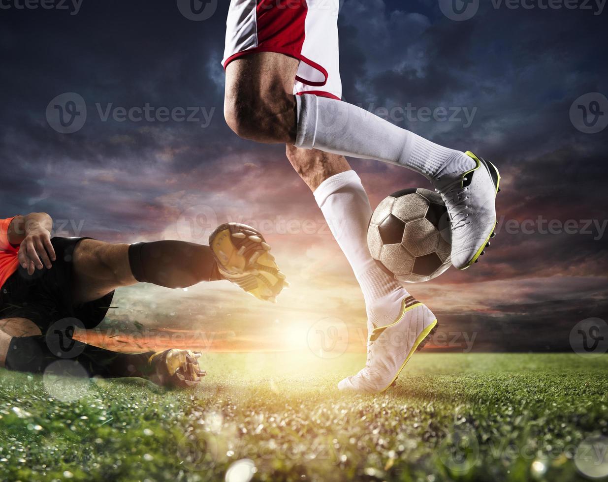 Soccer players with soccerball at the stadium during the match photo