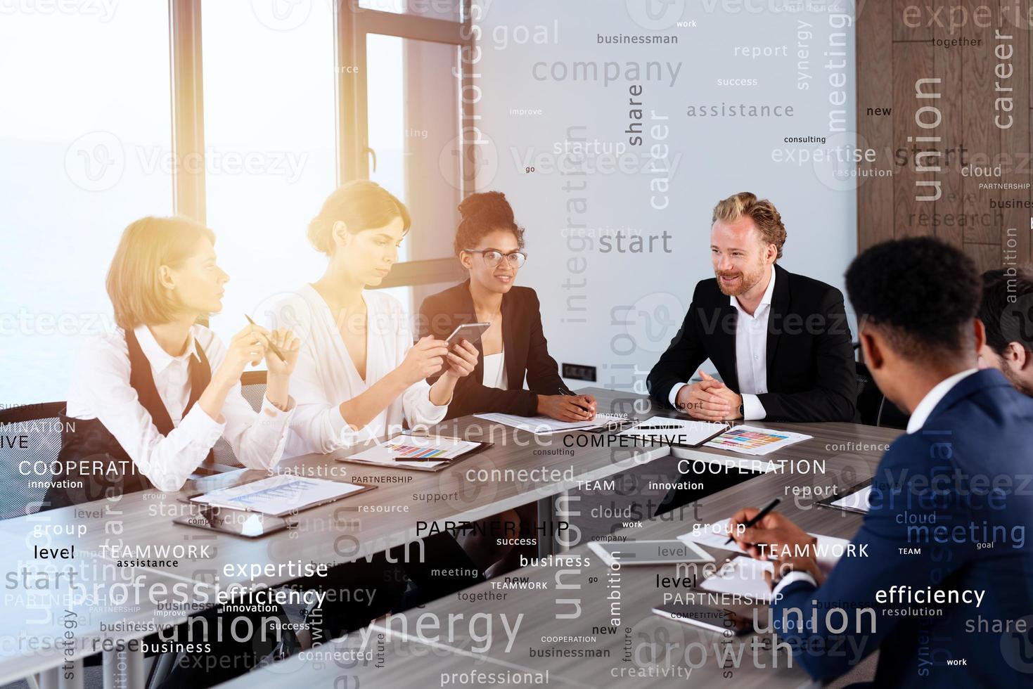 Team of people work together. concept of teamwork and partnership. Most important business terms in overlay photo