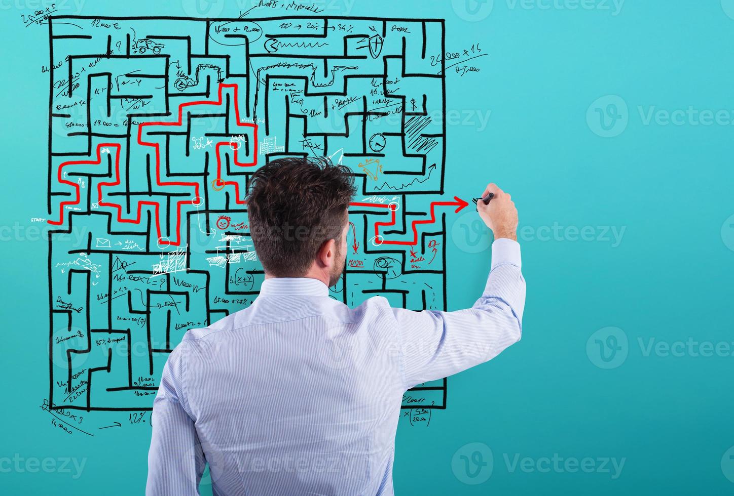 Businessman solve a complex maze with a lot of difficulties photo