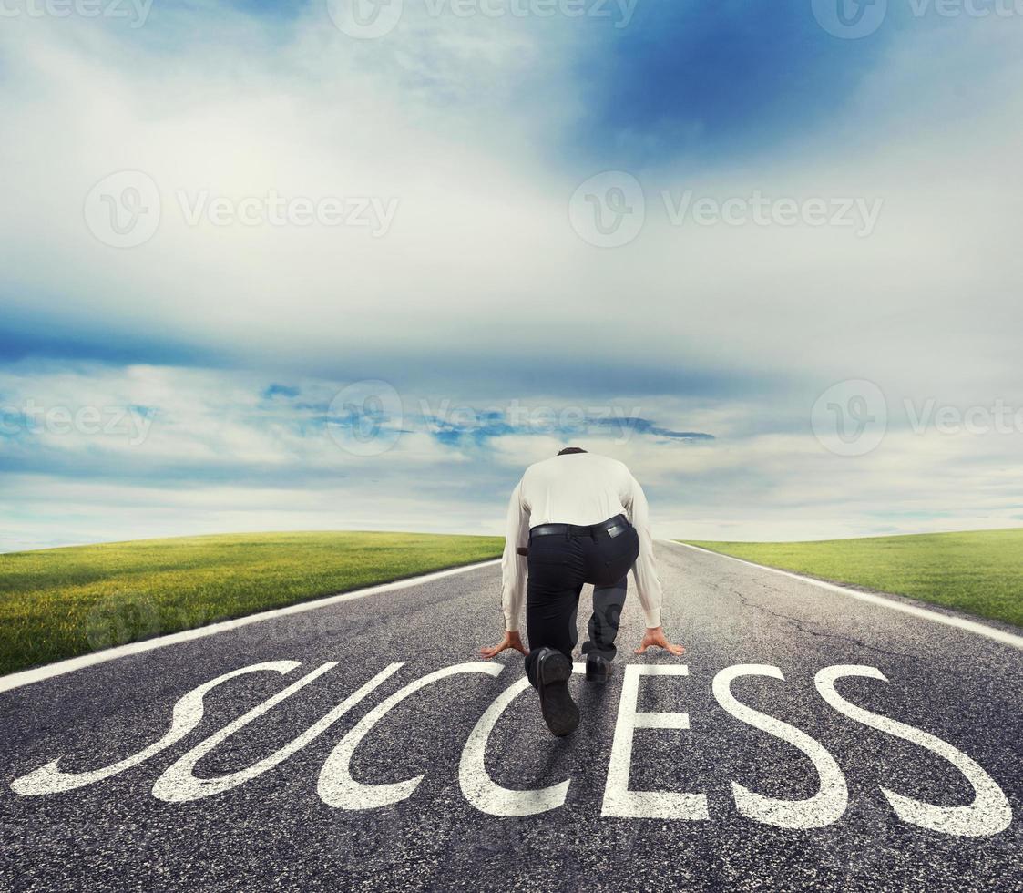 Man ready to run on a success way. Concept of successful businessman and company startup photo