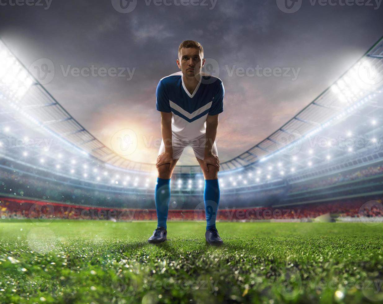 Soccer player ready to kick the soccerball at the stadium during the match photo