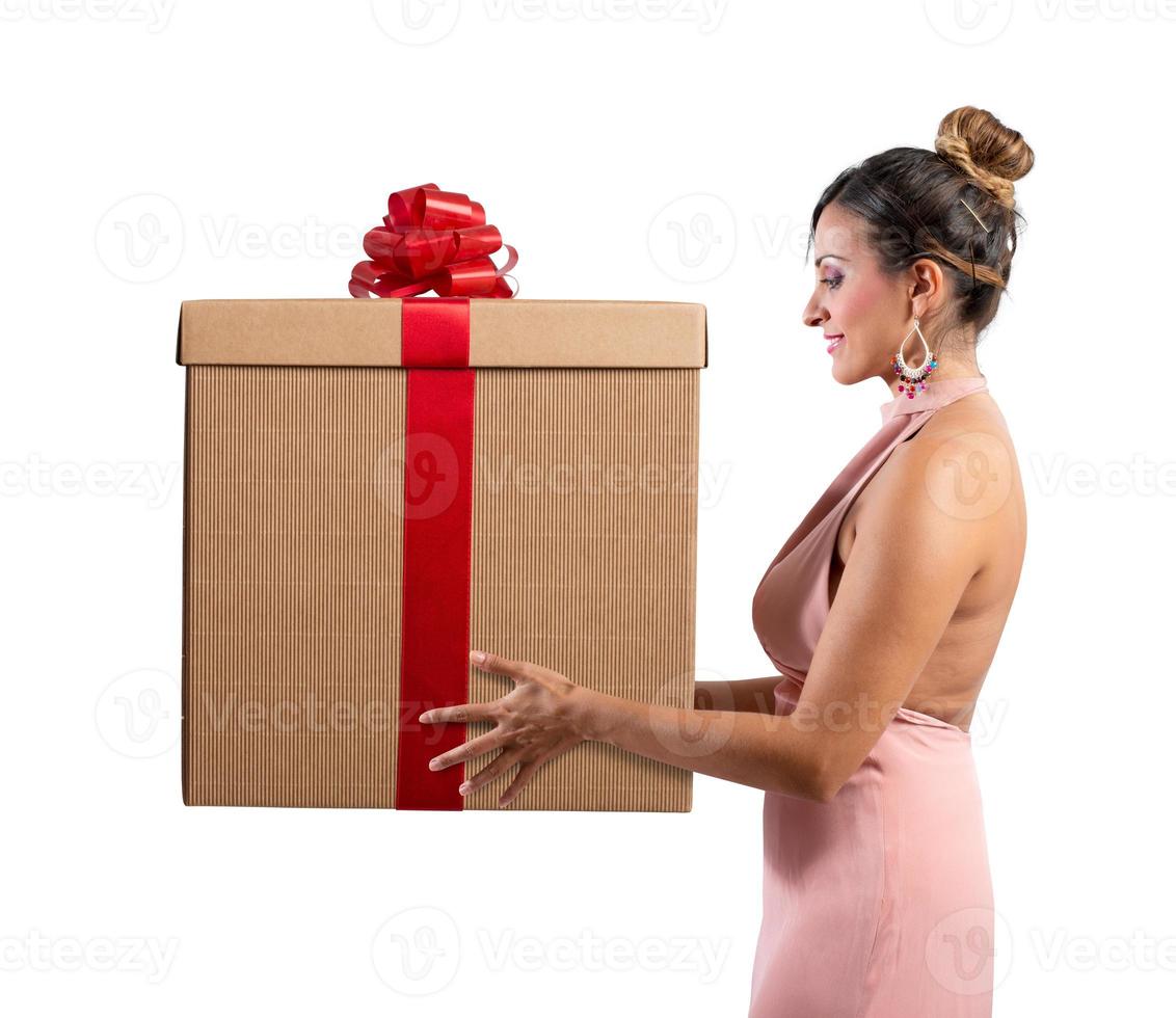 woman receives a big gift for christmas photo
