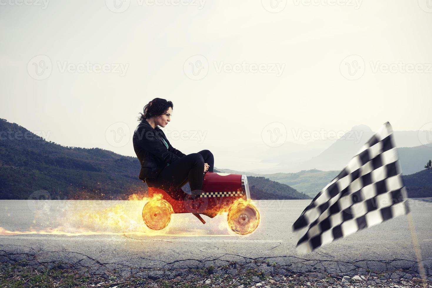 Fast businesswoman with a car wins against the competitors. Concept of success and competition photo