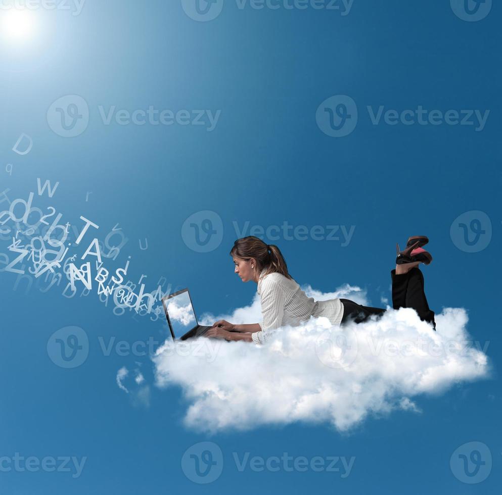 Businesswoman over a cloud photo