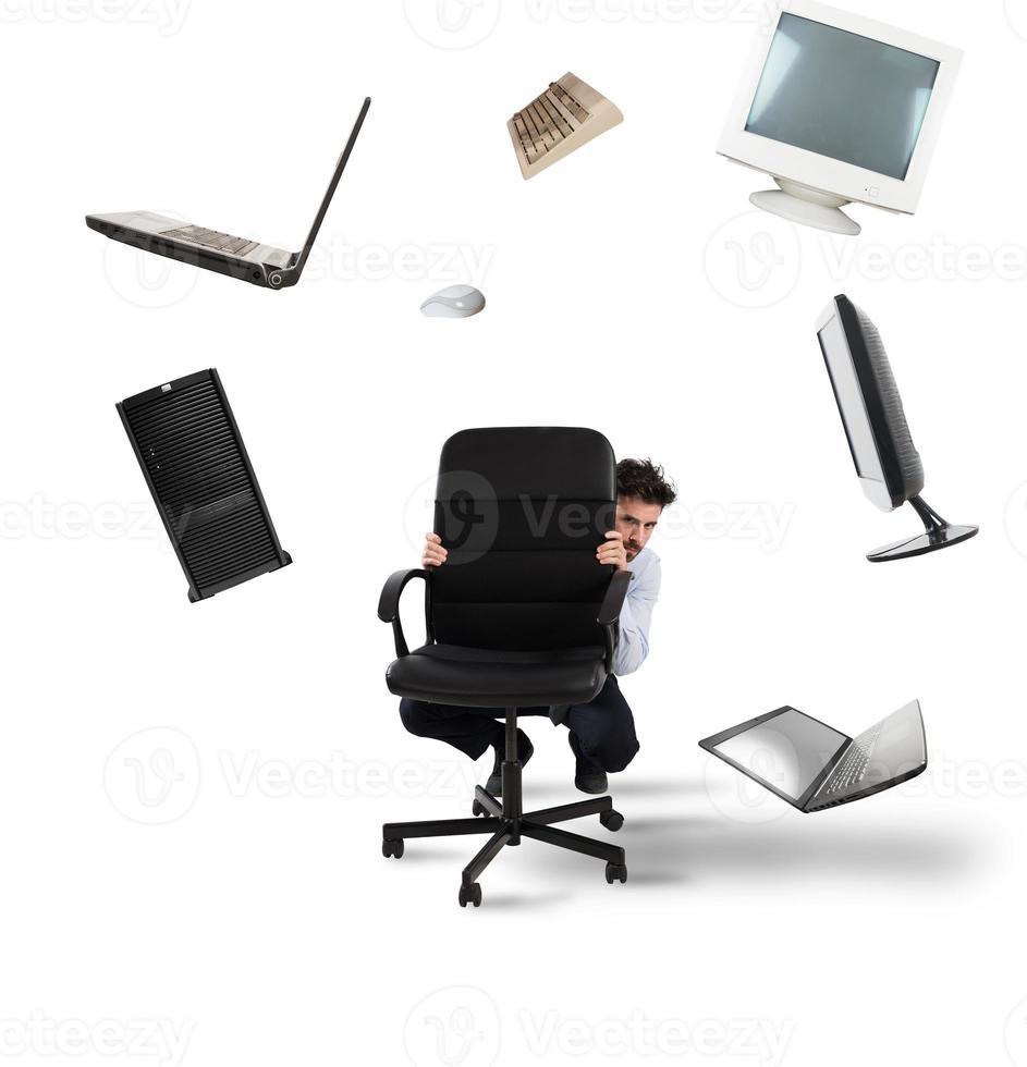 Businessman has fear of computers and technology photo