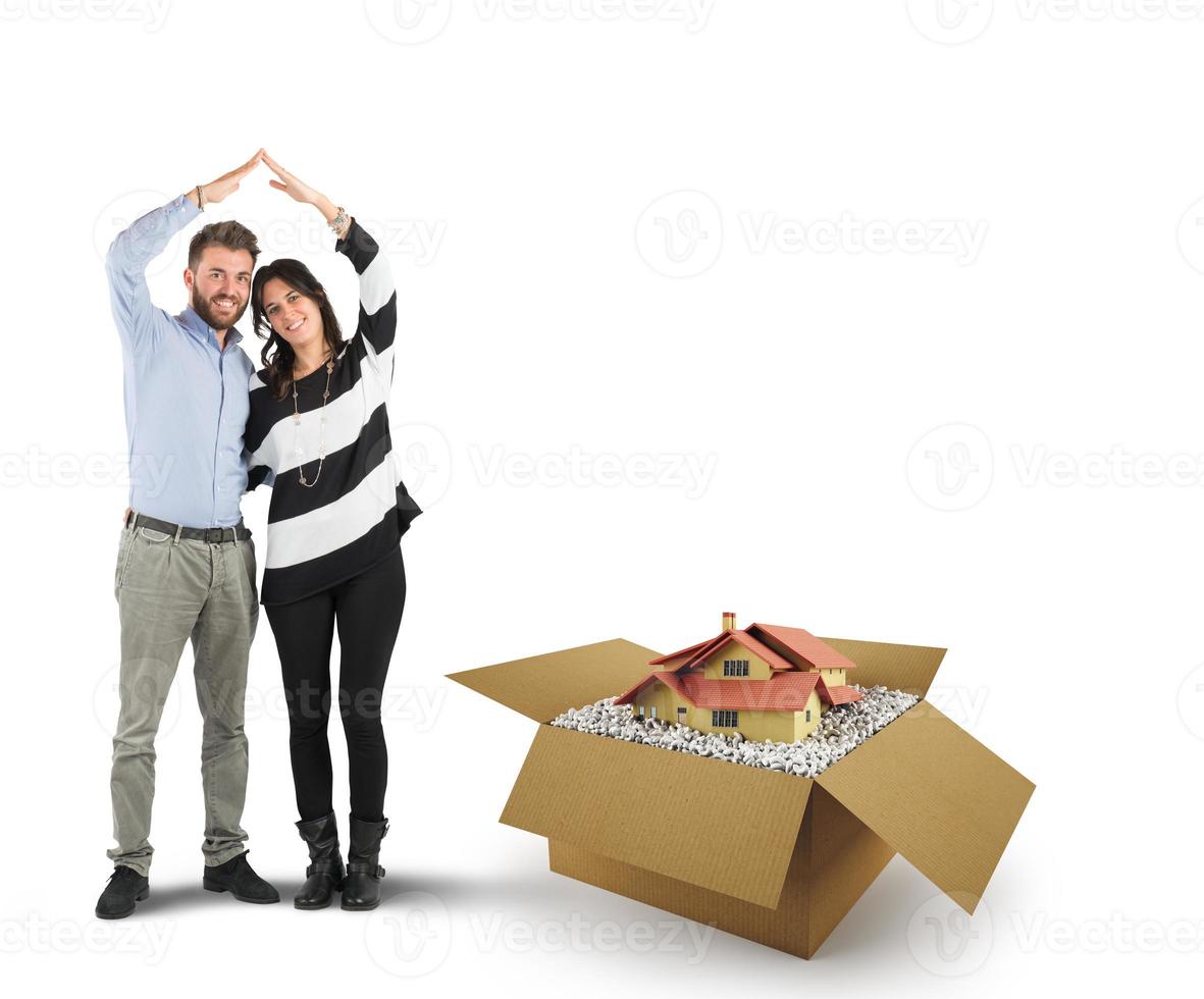 House in a cardboard box. Concept of buying a dwelling photo
