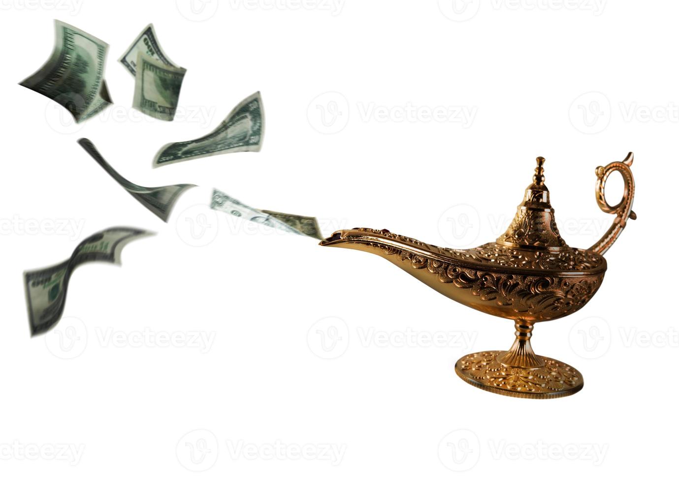 Banknotes exits from magic aladdin genie lamp photo