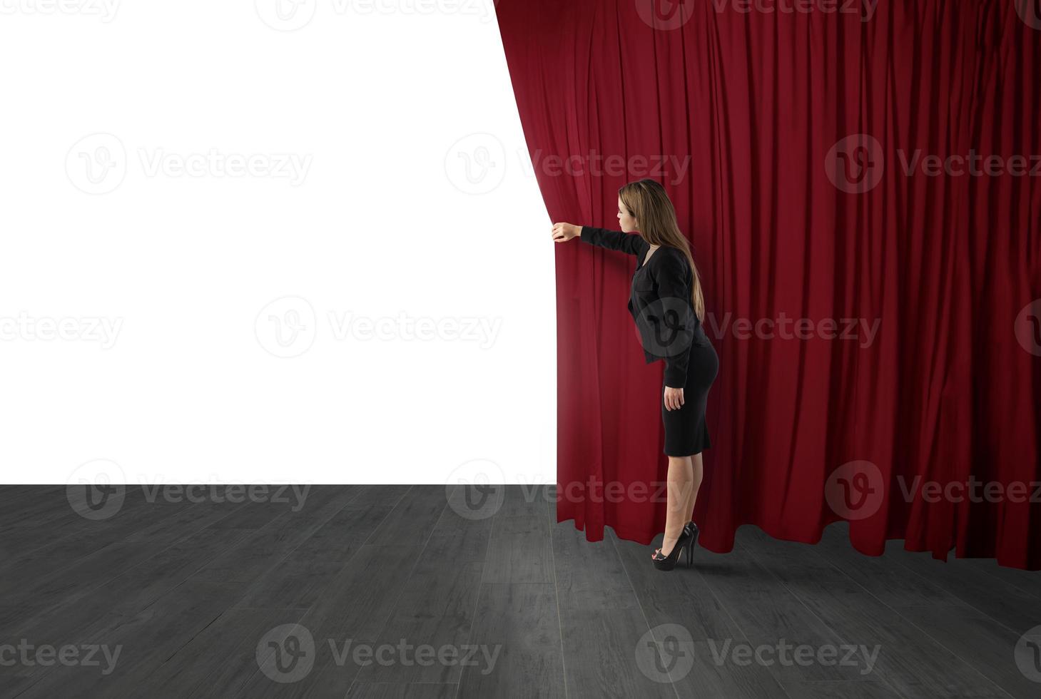 Woman open red curtains of the theater stage. blank space for your text photo