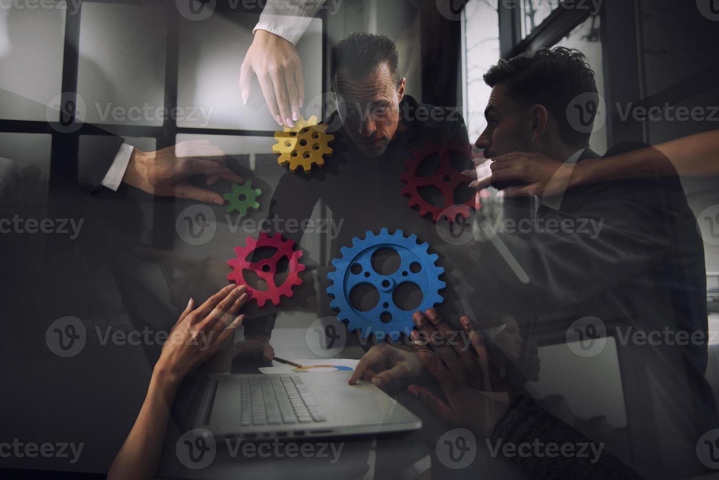 Business team connect pieces of gears. Teamwork, partnership and integration concept. Double exposure photo