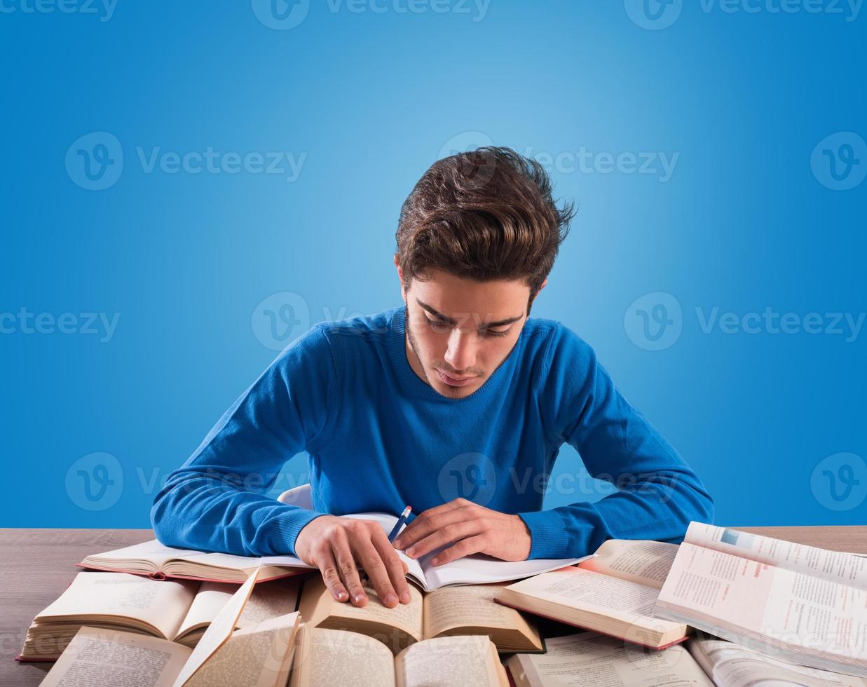 Student is studying hard on the desk photo