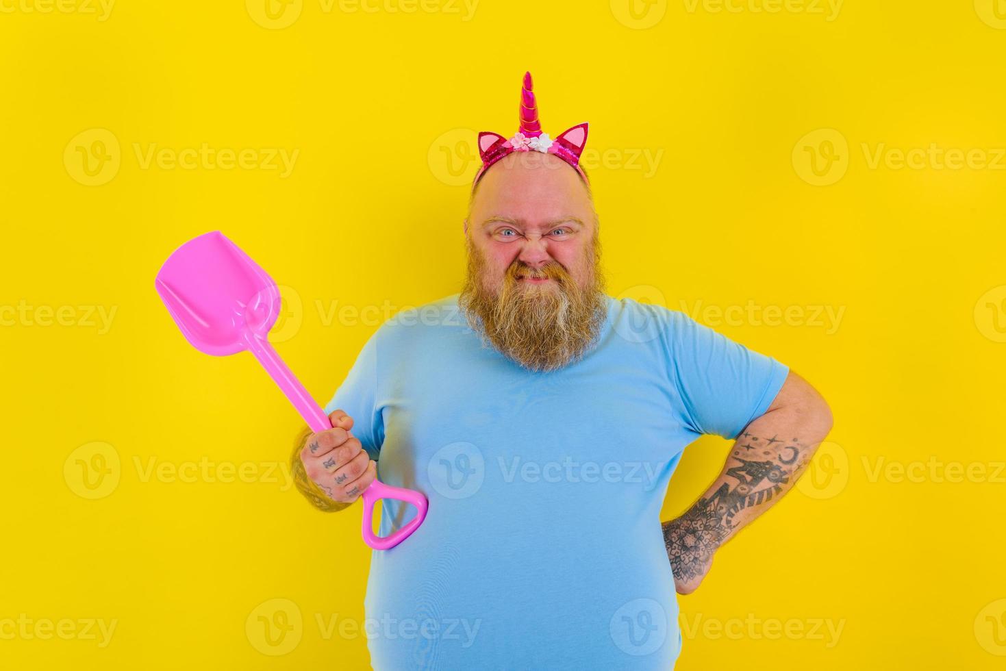 fat man with headband play with sea paddle photo
