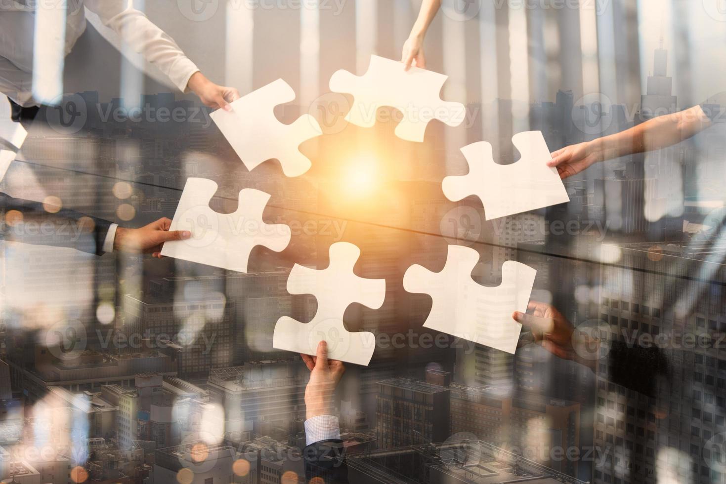 Teamwork of partners. Concept of integration and startup with puzzle pieces. Double exposure photo