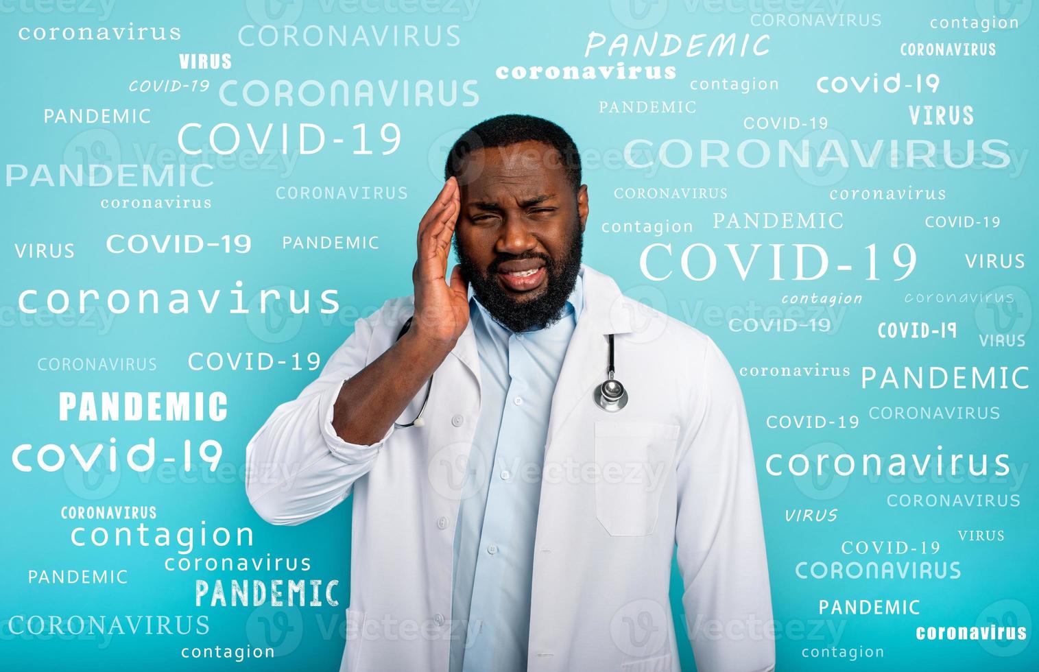 Doctor is exhausted due to overwork by coronavirus covid-19. Cyan background photo