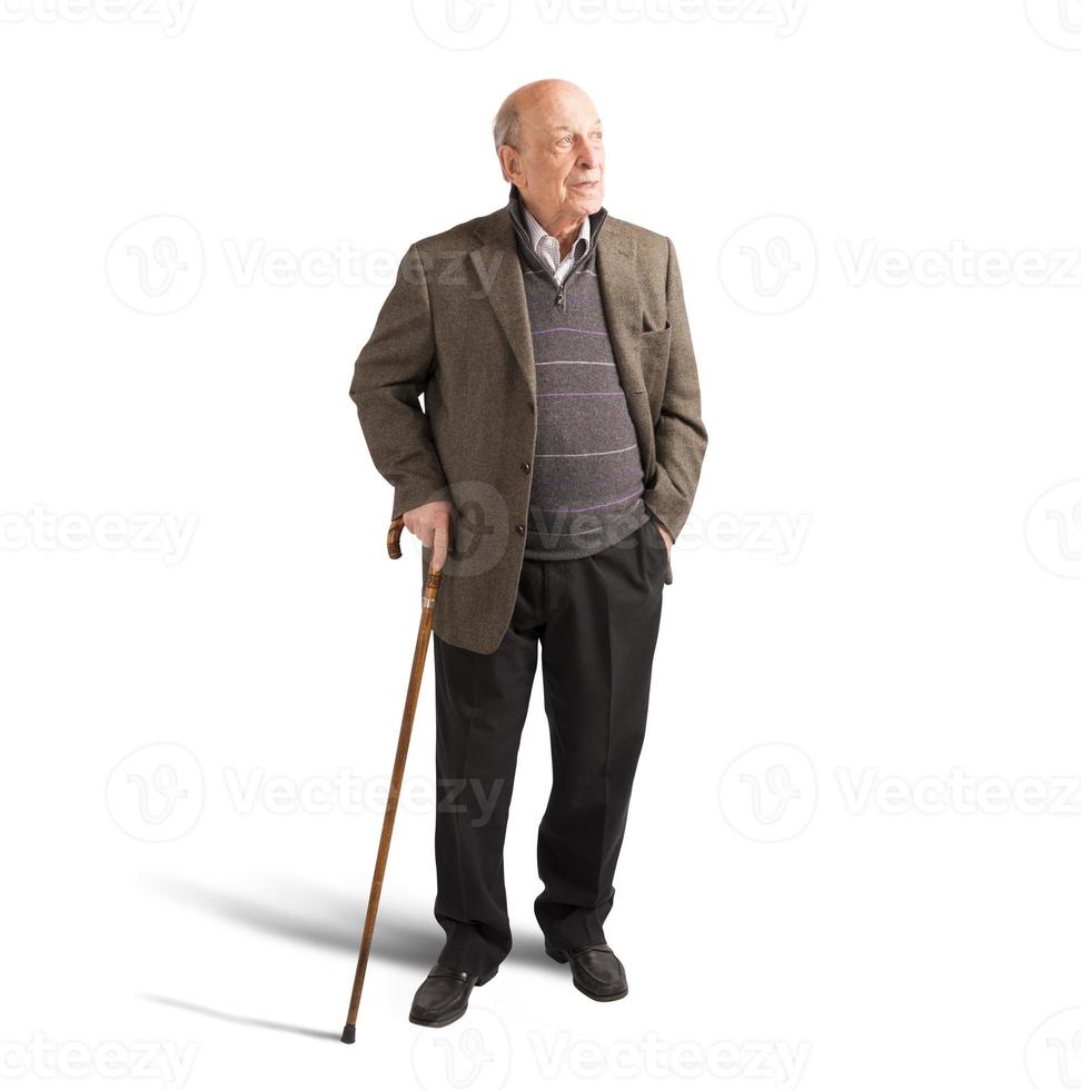 Elderly walking with stick photo