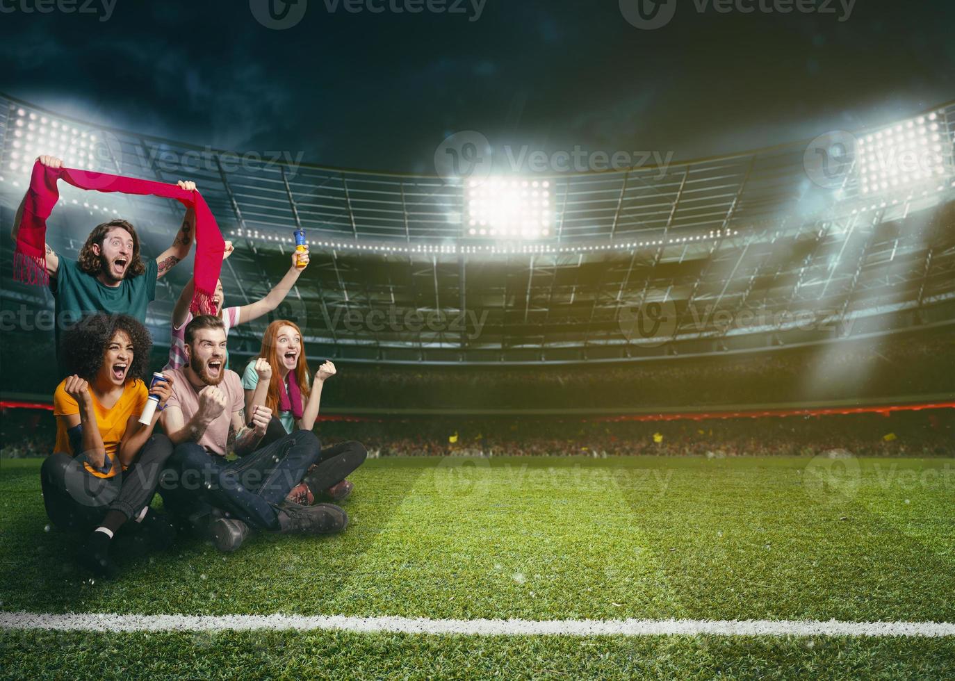 Soccer fans in the middle of the action during a night game at the stadium photo