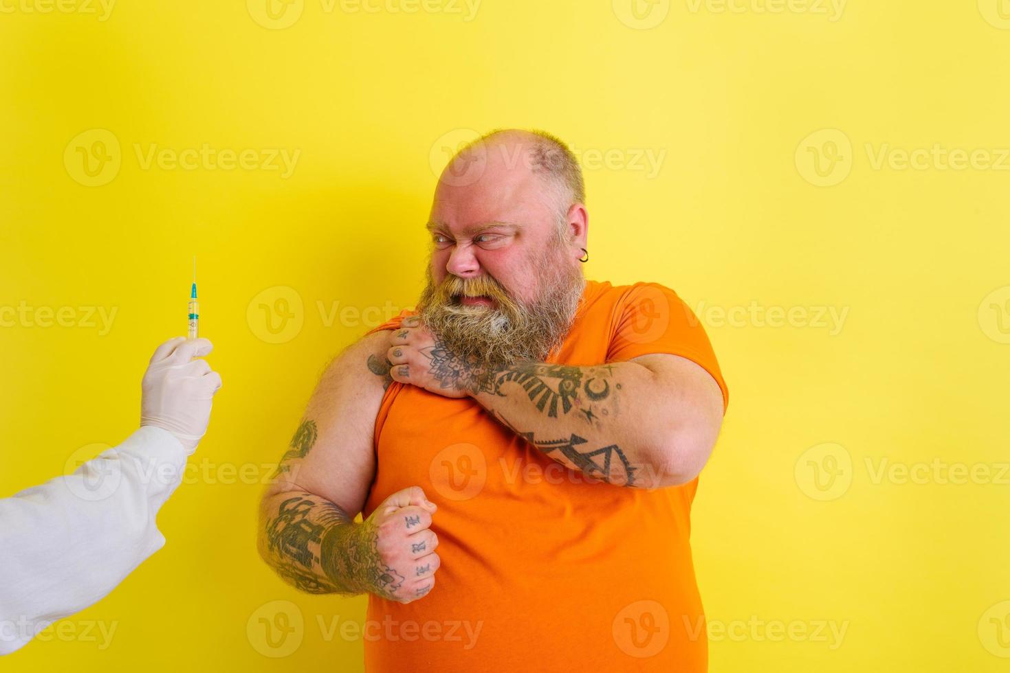 Doubter man is afraid of getting the covid-19 vaccine photo