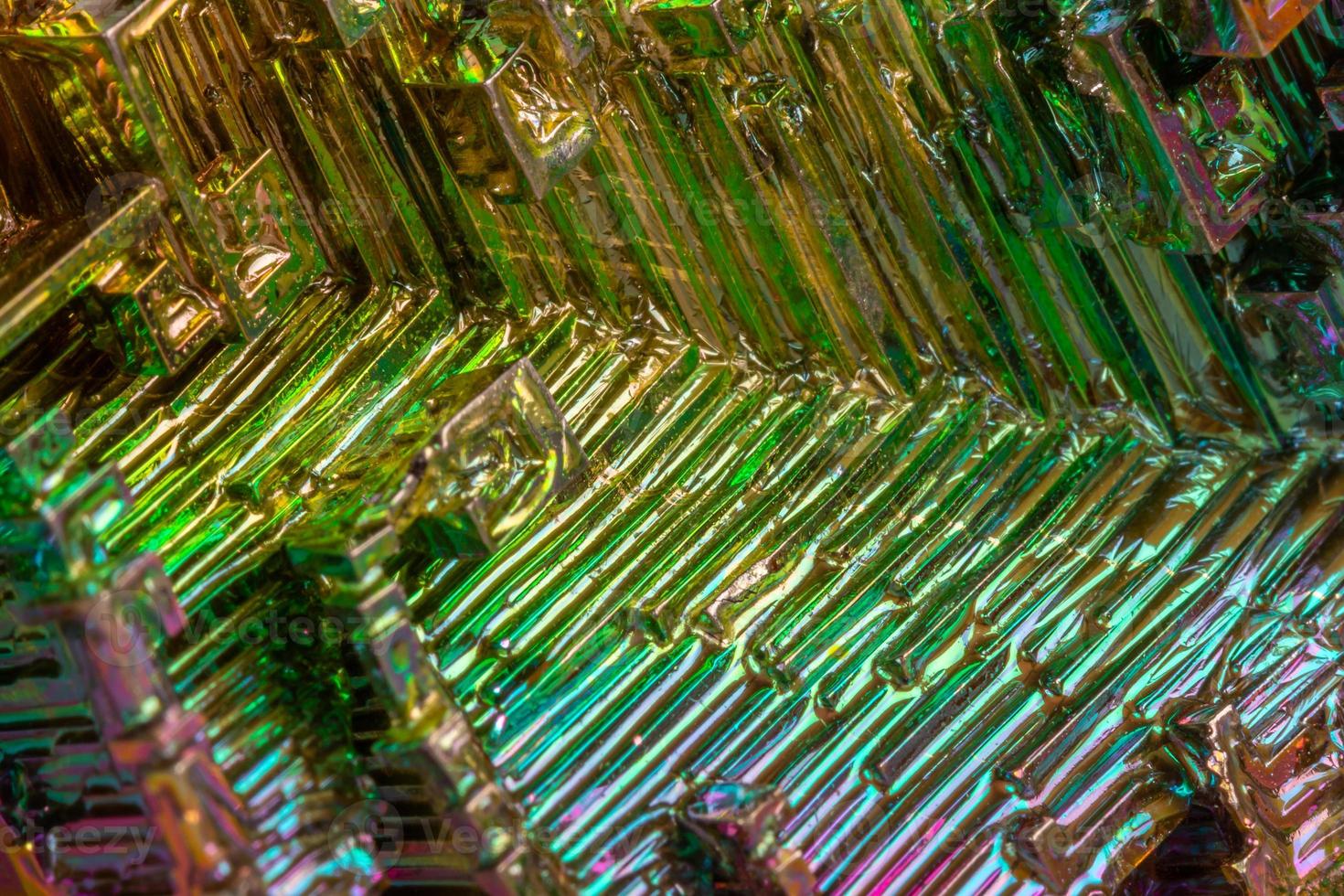 Macro of the mineral bismuth stone on a white background photo