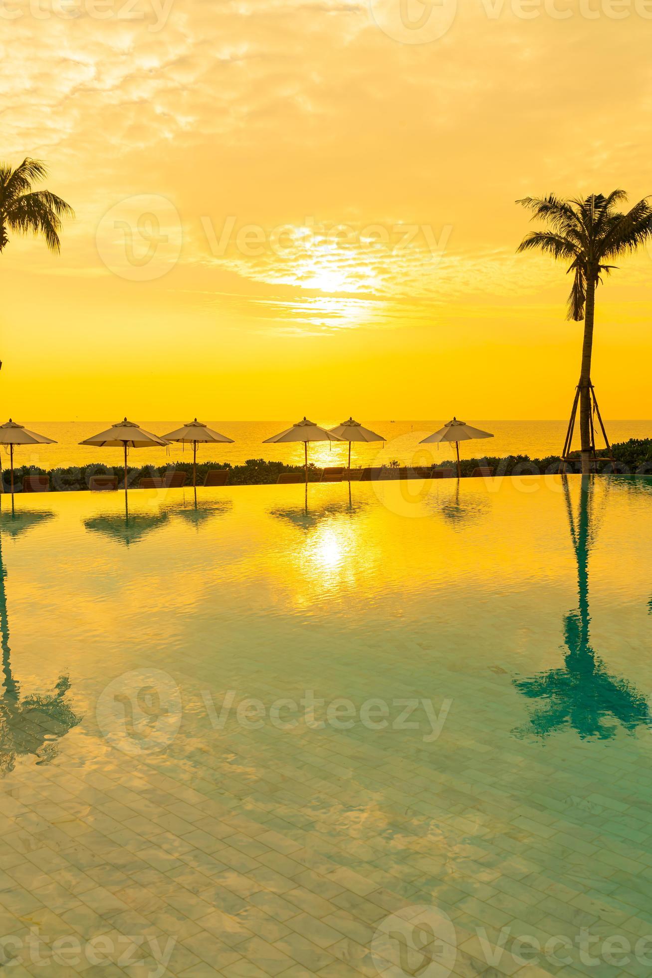 umbrella with bed pool around swimming pool with ocean sea background