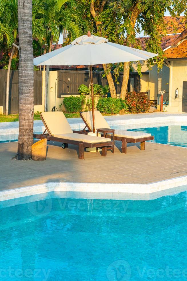 umbrella with bed pool around swimming pool with ocean sea background