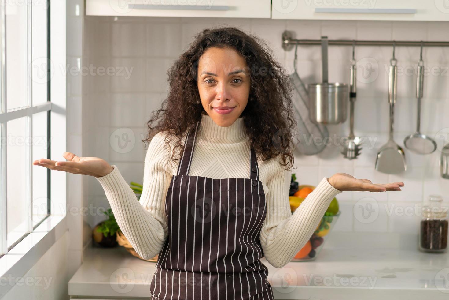 portrait Latin woman in kitchen photo
