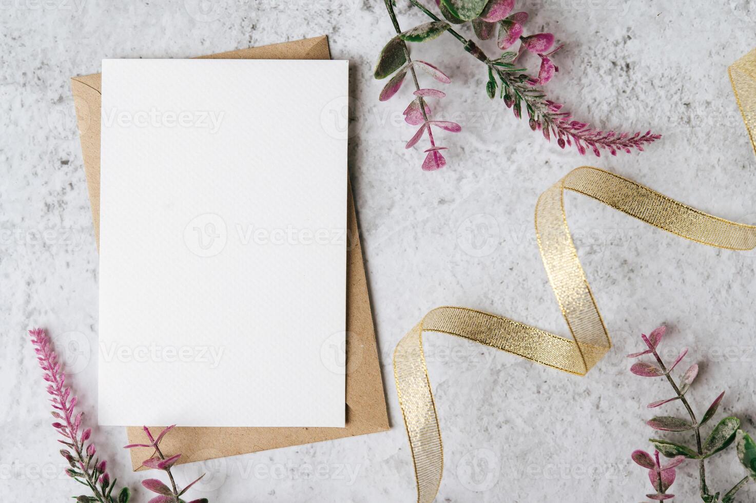 Envelopes and beautiful flowers on marble background photo