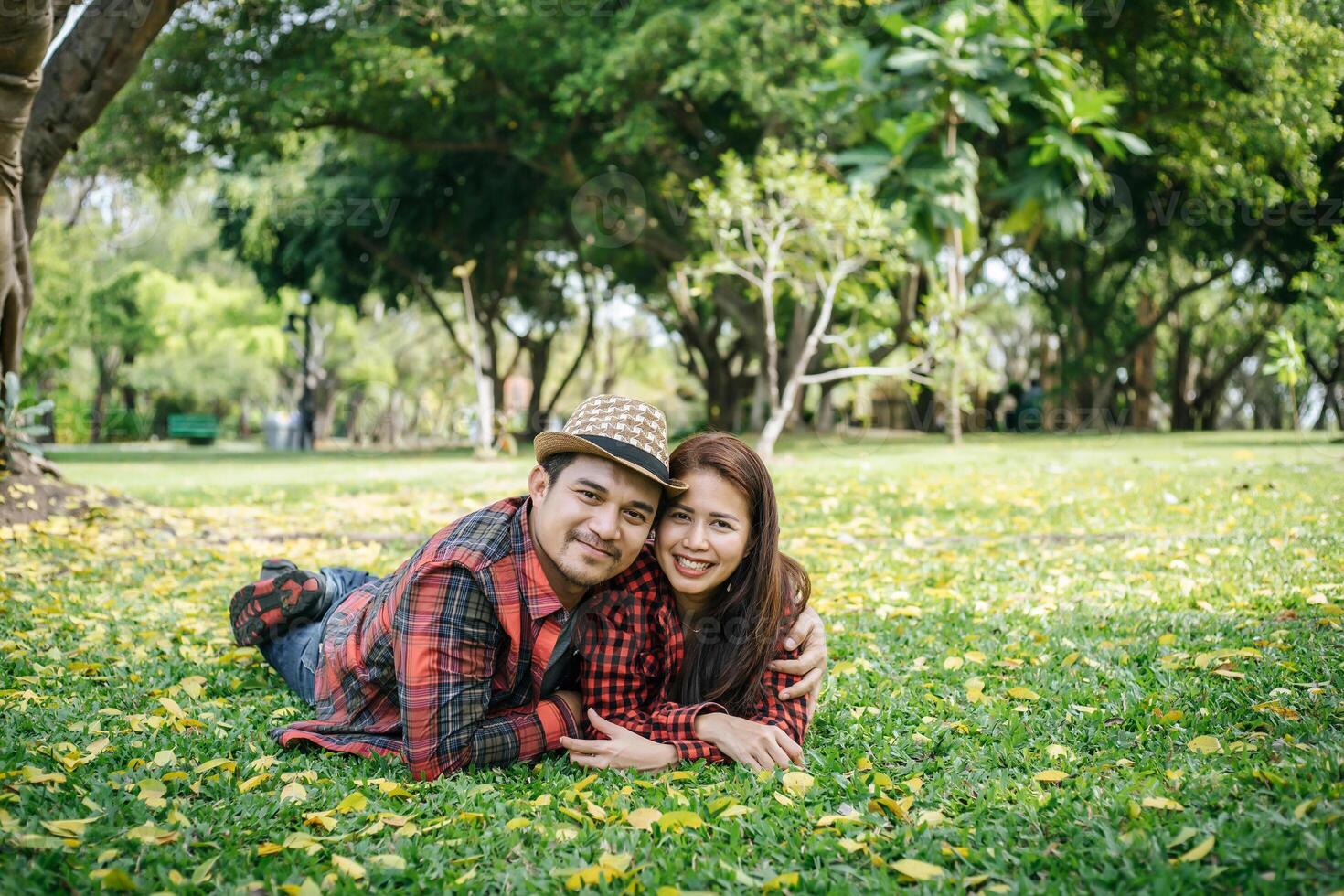 romantic young couple sitting in garden photo