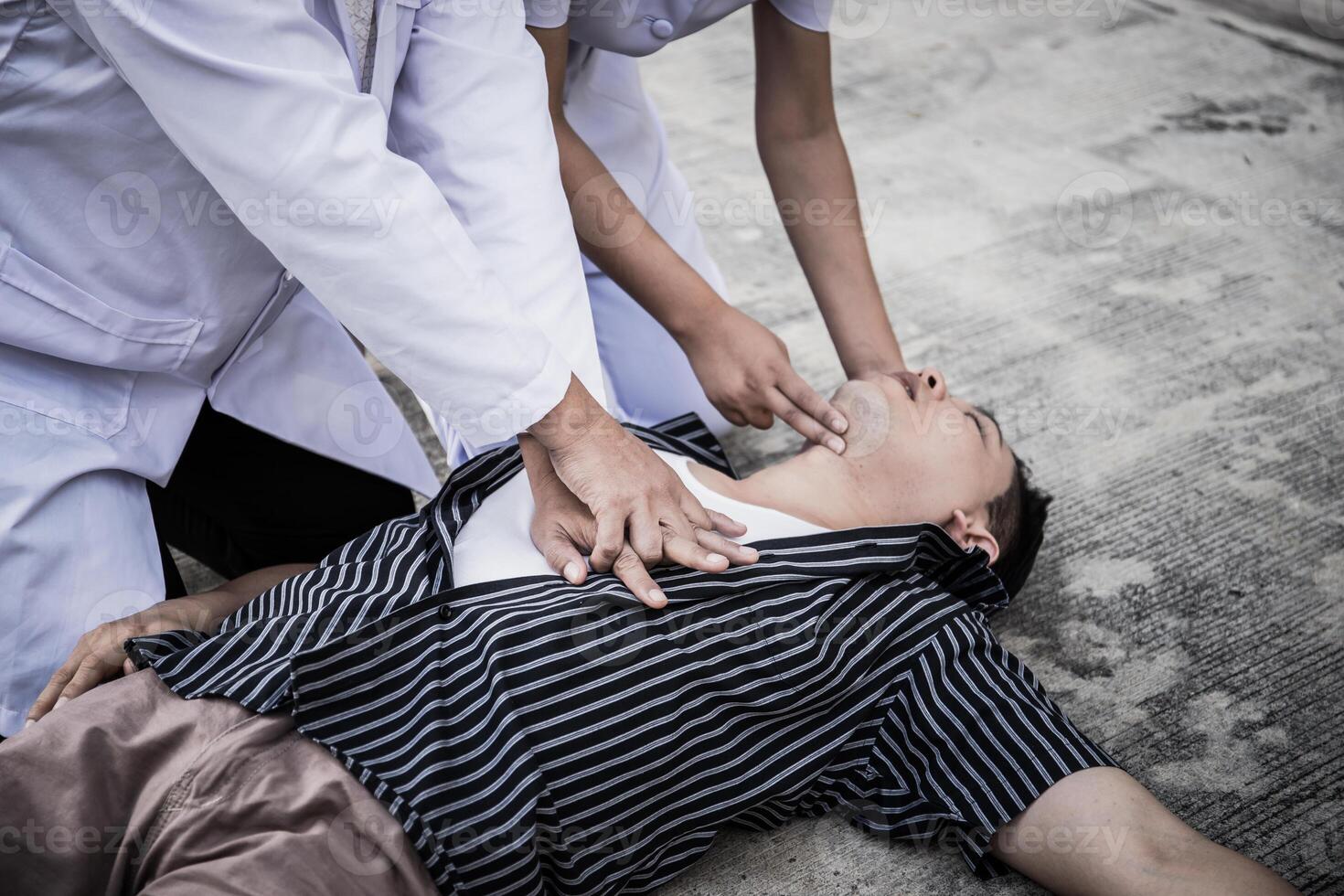 Emergency CPR on a Man, Nurse try to Process Resuscitation photo