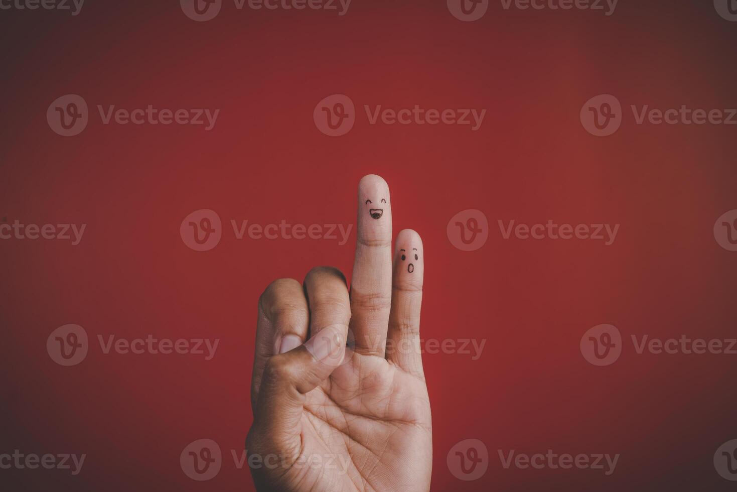 Red background and fingers and cute smile art concept photo