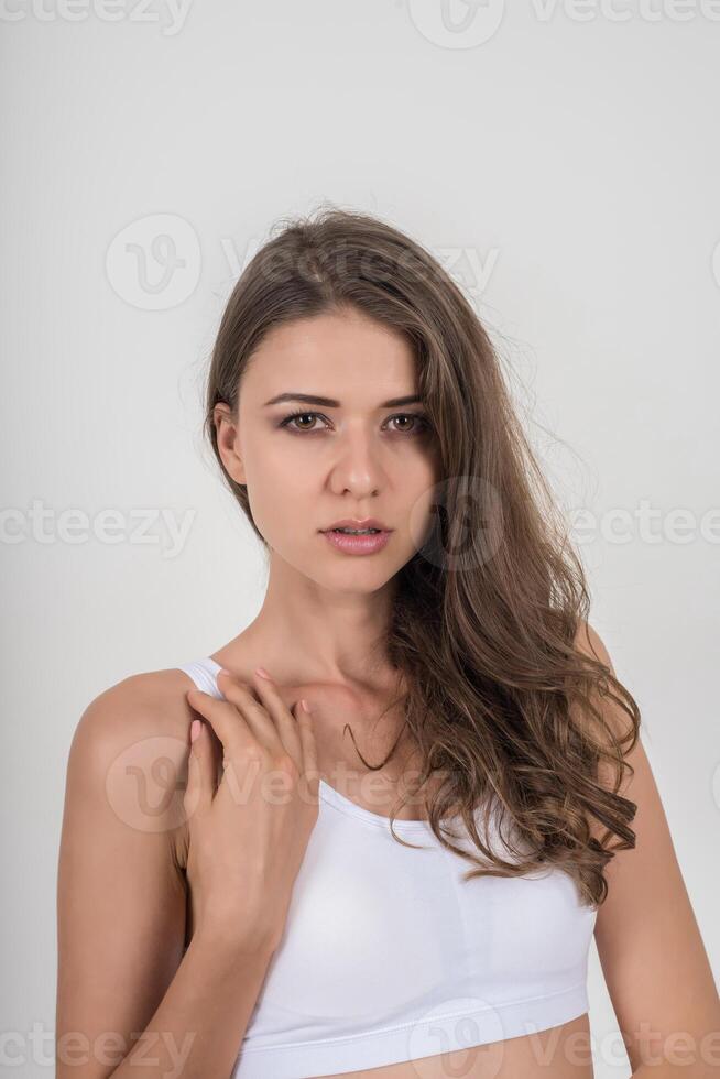 Beautiful woman with healthy body on white background photo