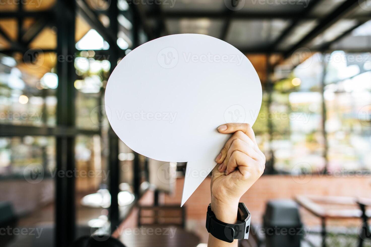 photo a young woman in a white shirt holding a thought box symbol