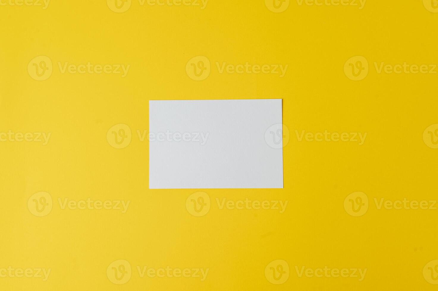 white paper on yellow background photo