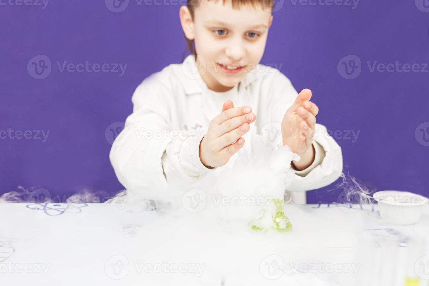 boy study science education. Chemical laboratory with test tubes for experiments and multi-colored liquids photo