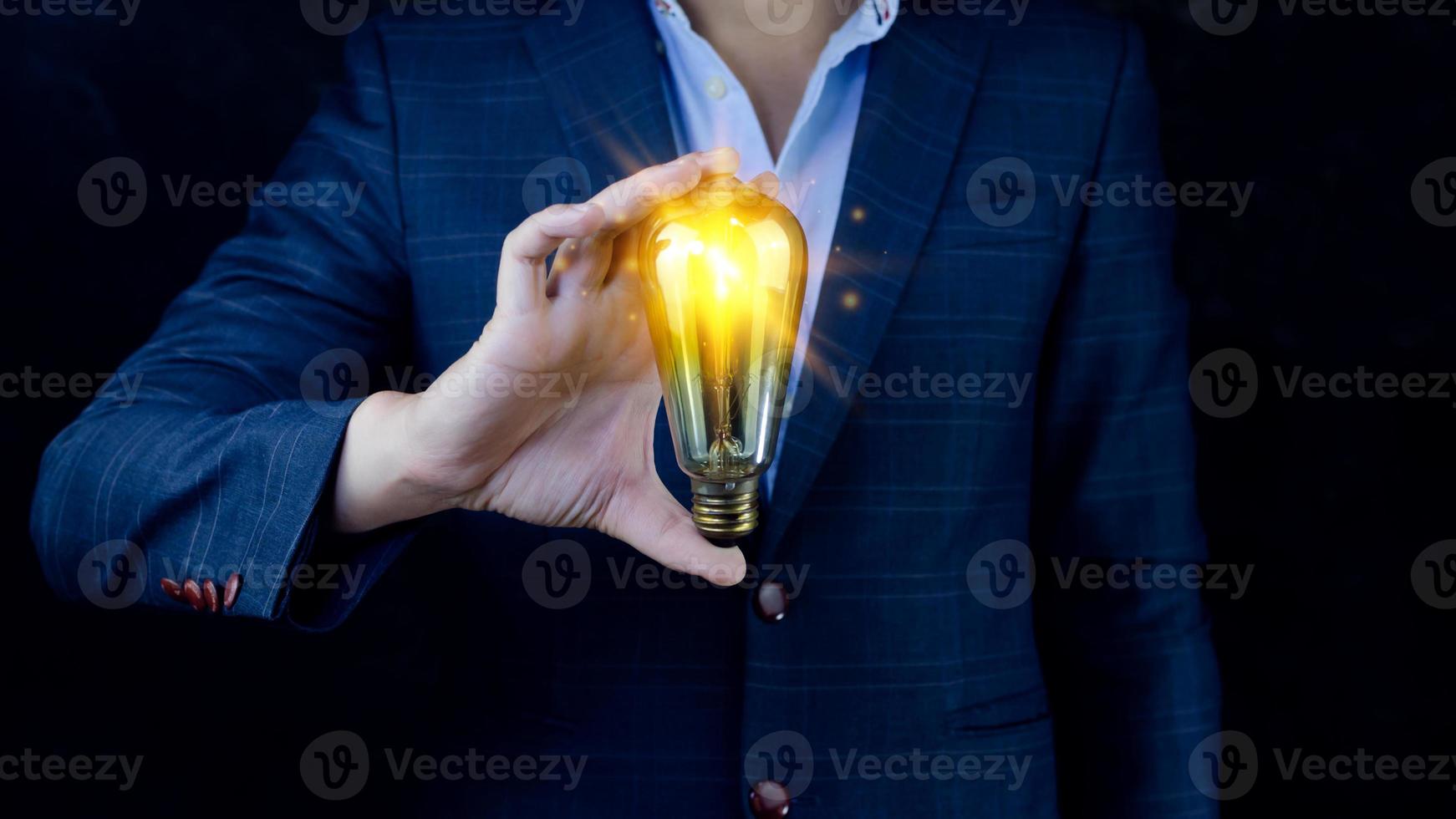 Bright idea in hand Business man,Hands holding light bulb for concept new idea concept with innovation and inspiration,technology in science and communication concept photo