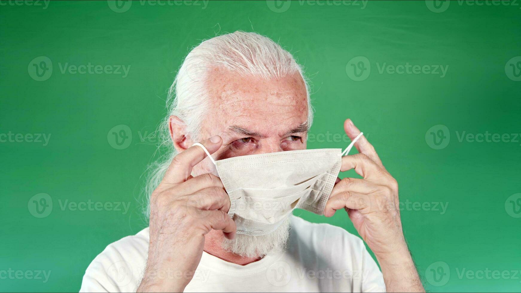 Old Man is Wearing Mask for Protection from Viruses photo