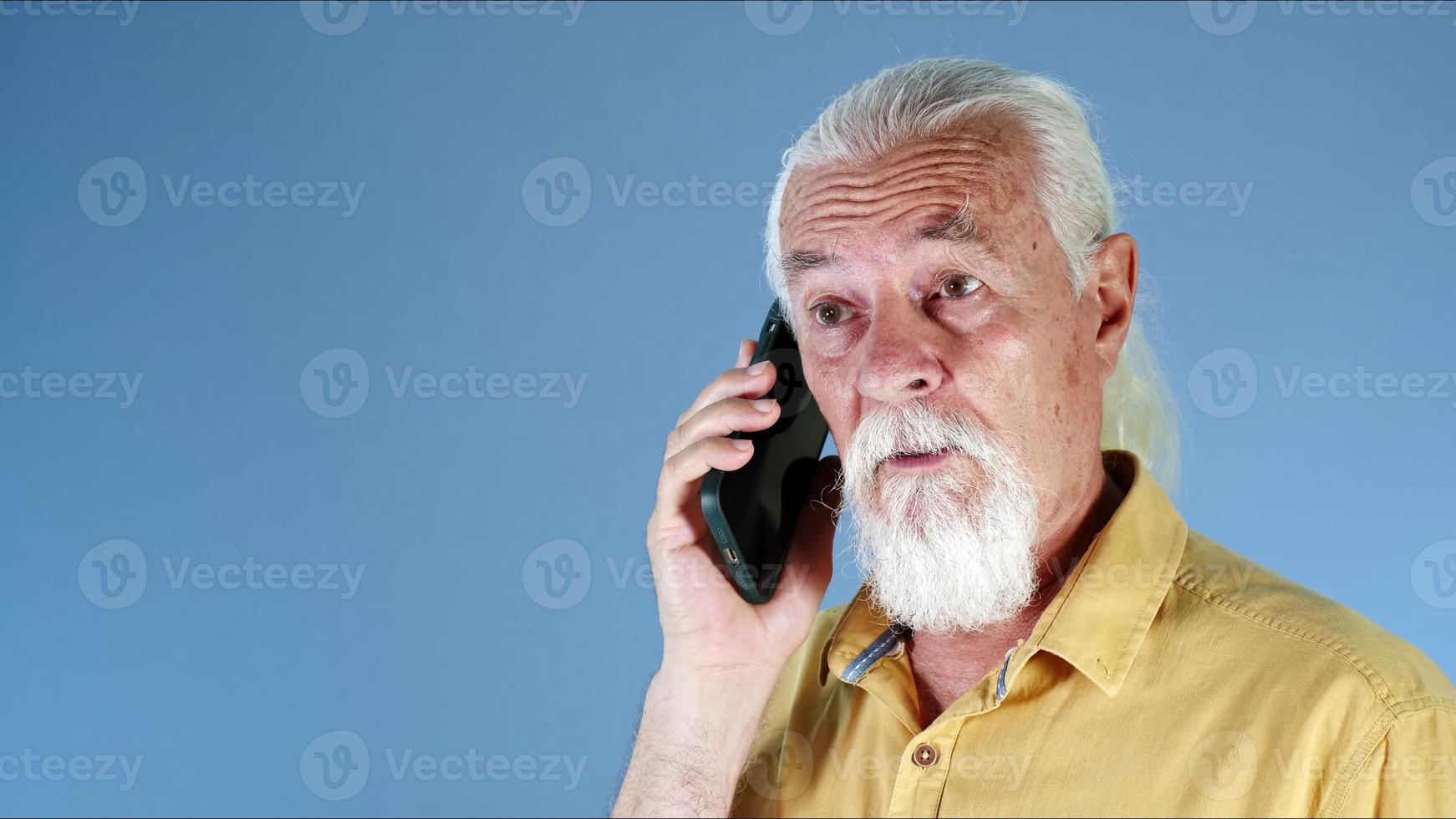 The White Haired Old Man Talks on the Cellphone photo