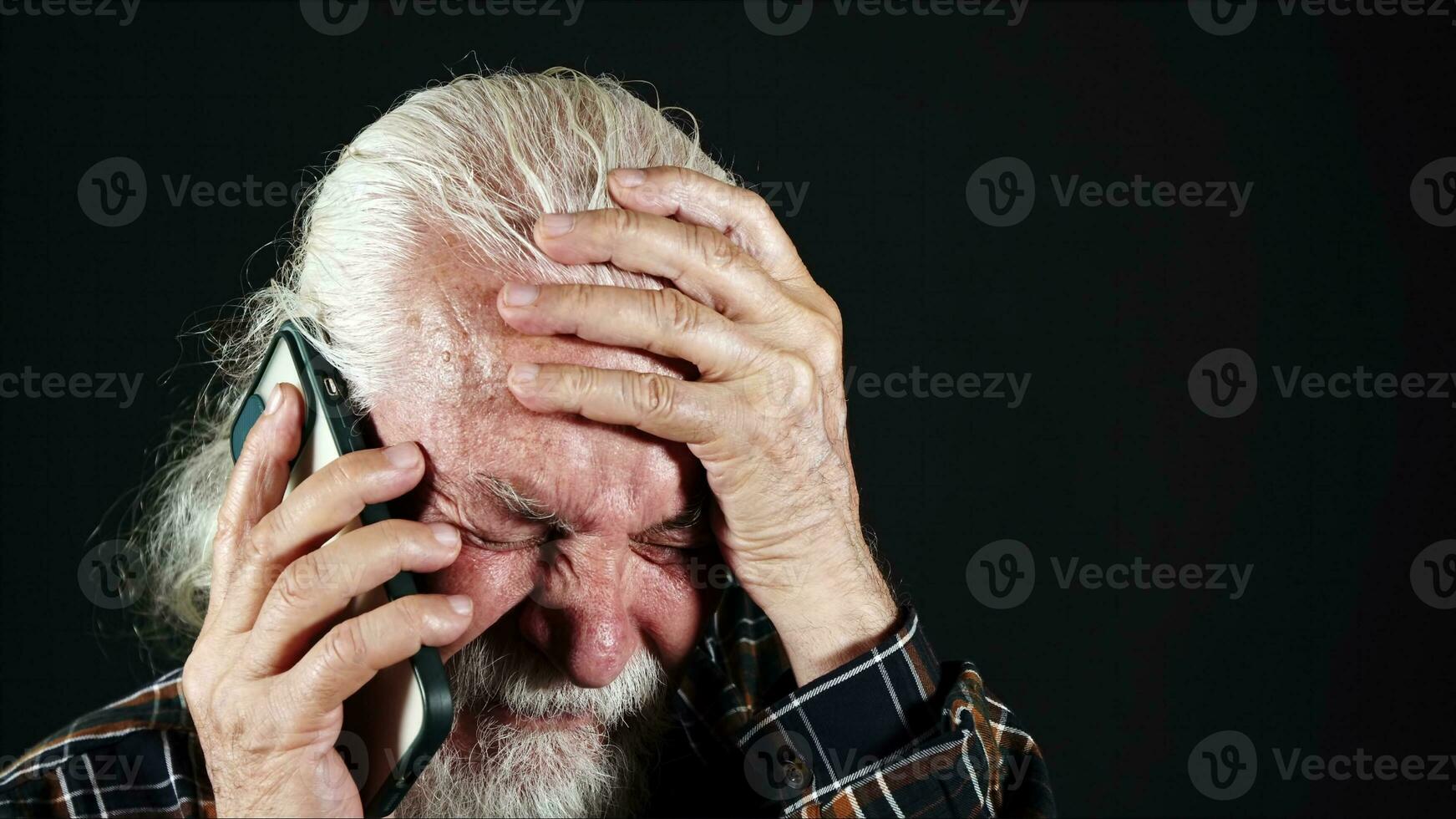 Old Man Gets a Bad News on the Phone photo