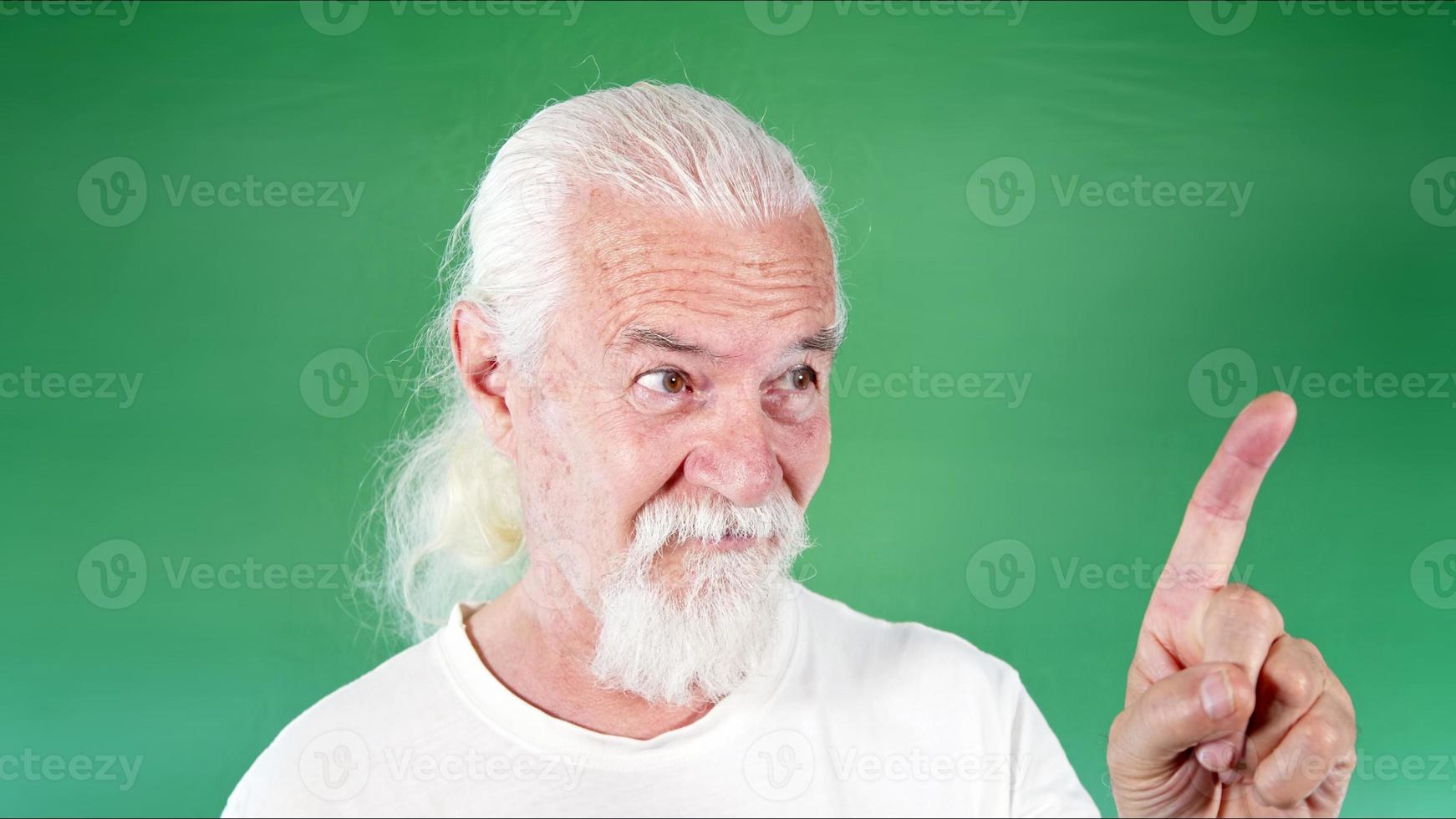 Old Man is Warning With His Finger photo