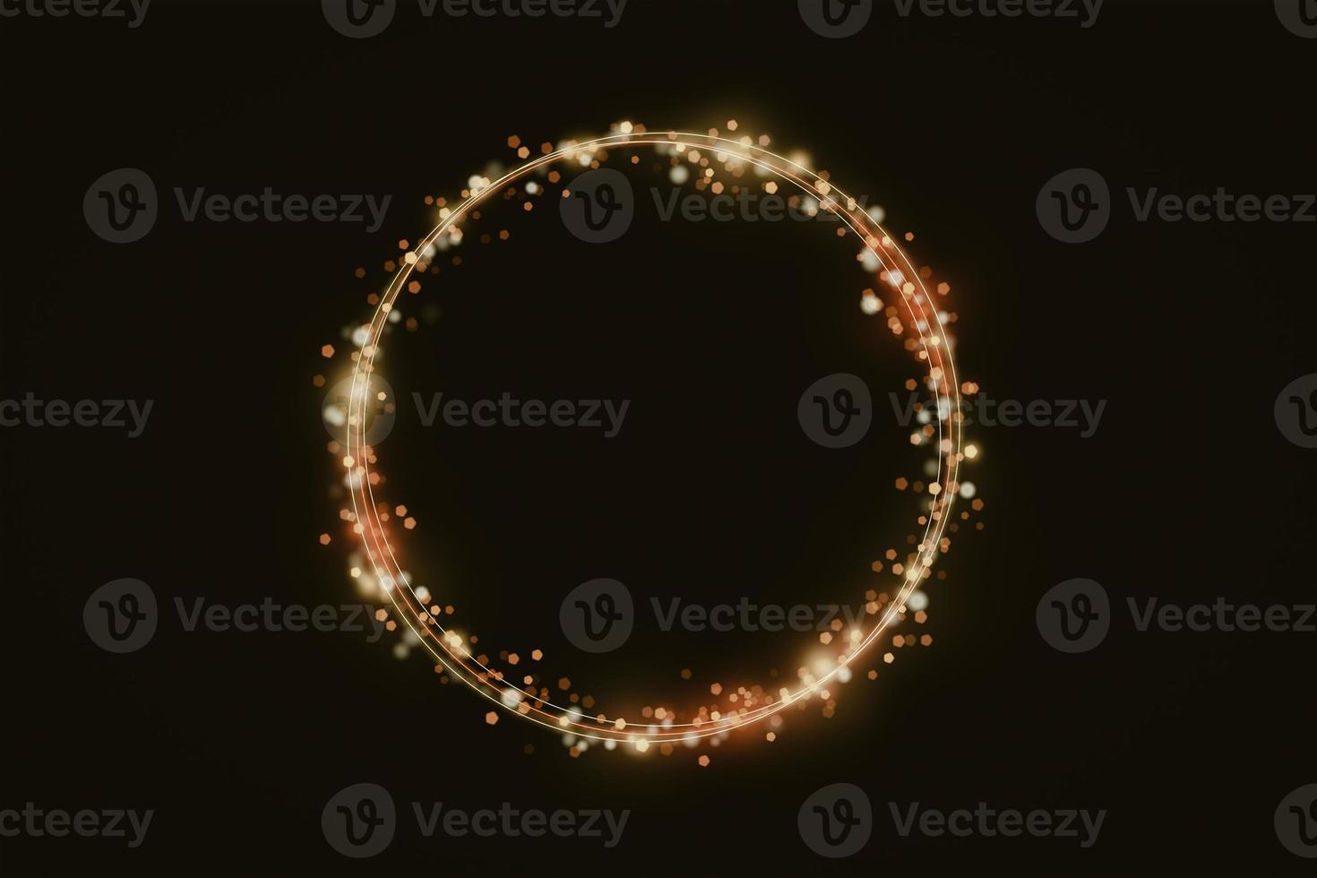 Golden shimmering circle of glittering particles on black background, copy space photo