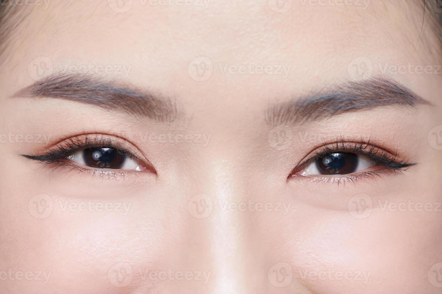 A half of a beautiful female's face with eye bags photo